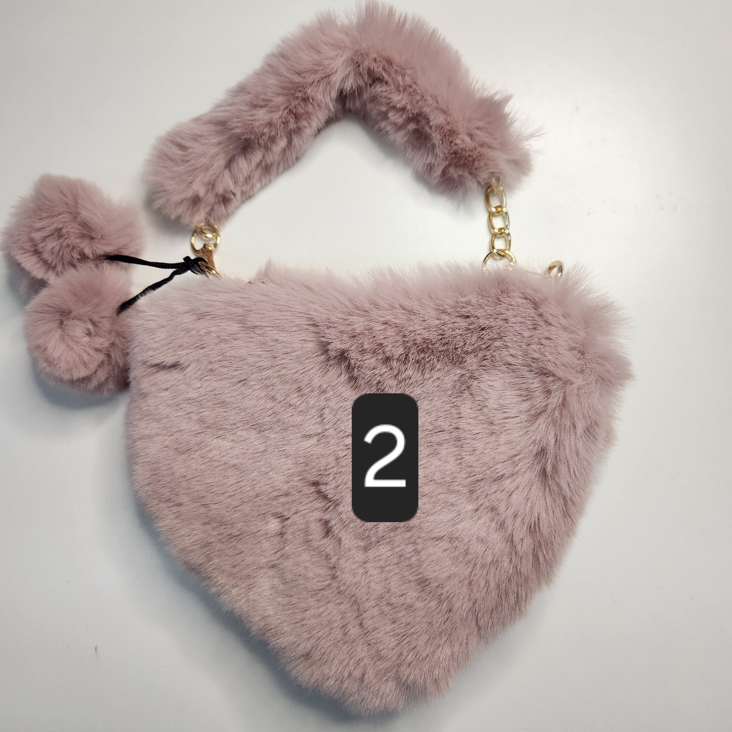 Sac fausse fourrure en coeur