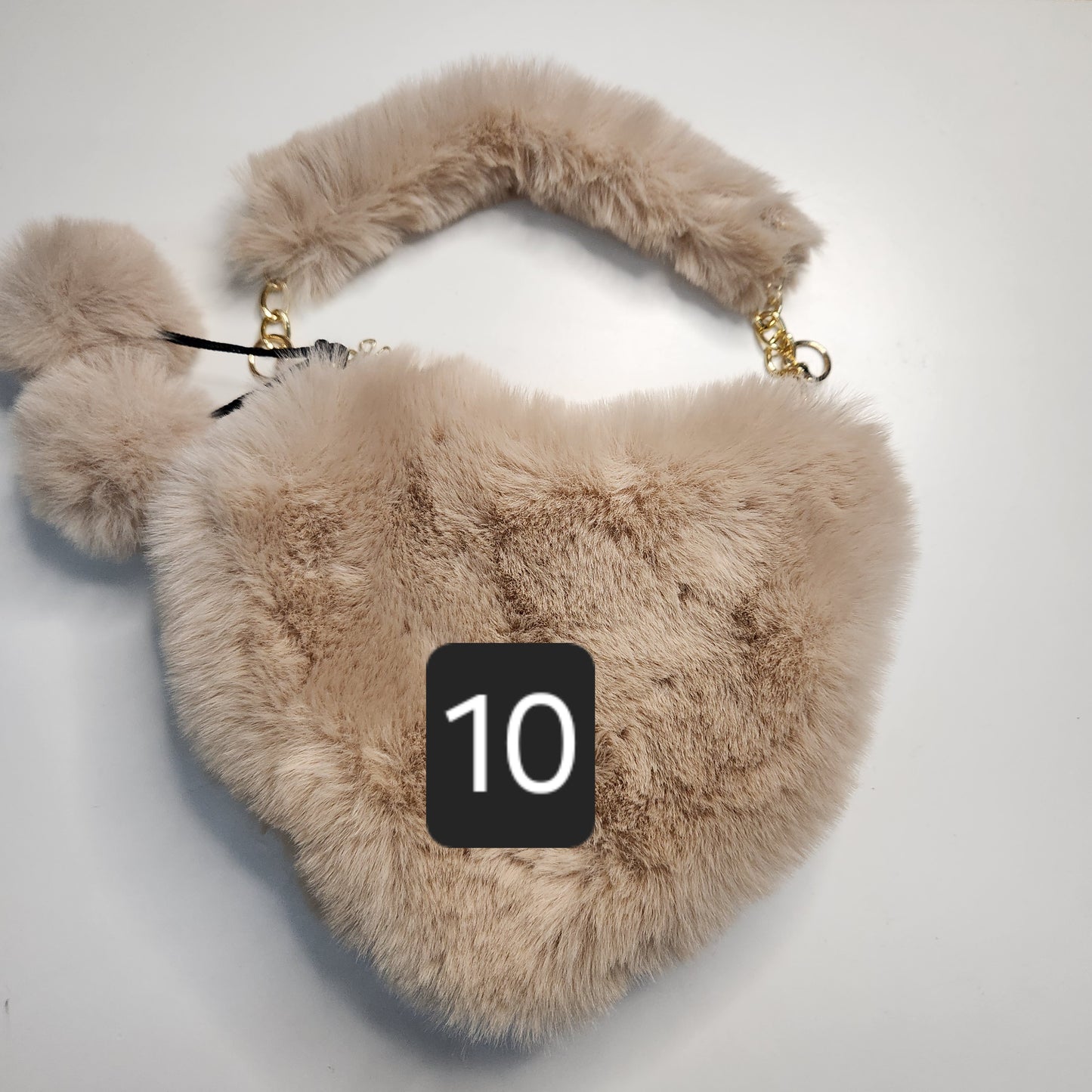 Sac fausse fourrure en coeur