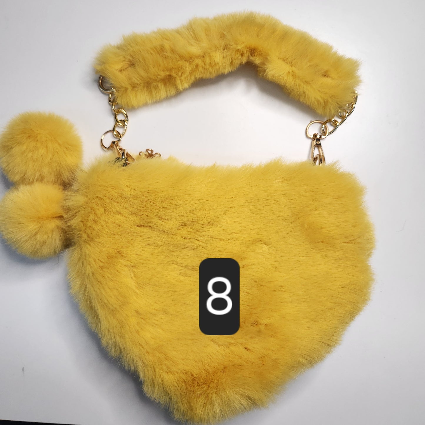 Sac fausse fourrure en coeur